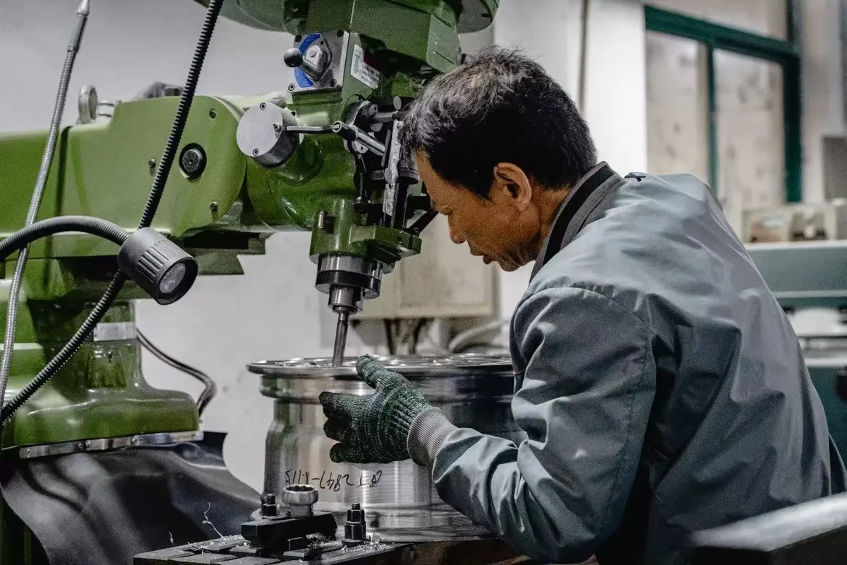 Alloy wheel quality control inspection at partner facility